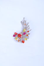 Silver lapel brooch for men with peacock feather design and crystal accents for ethnic wear.