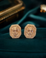 Silver stud earrings for women with octagon design and baguette-style clear crystals online.