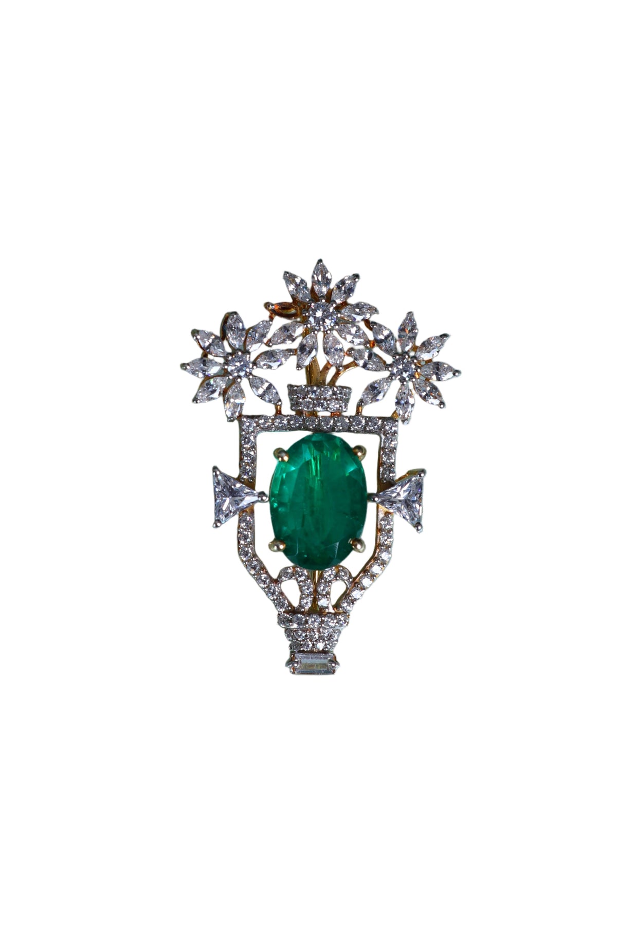 Silver designer brooch with green oval center and starburst crystal surround