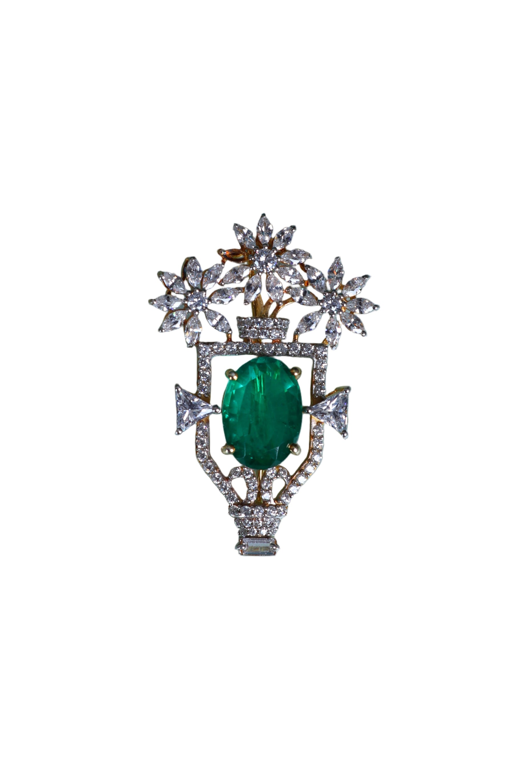 Silver designer brooch with green oval center and starburst crystal surround