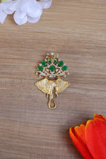 Silver lapel brooch for men with Ganesha motif, green stones and crystal accents online.