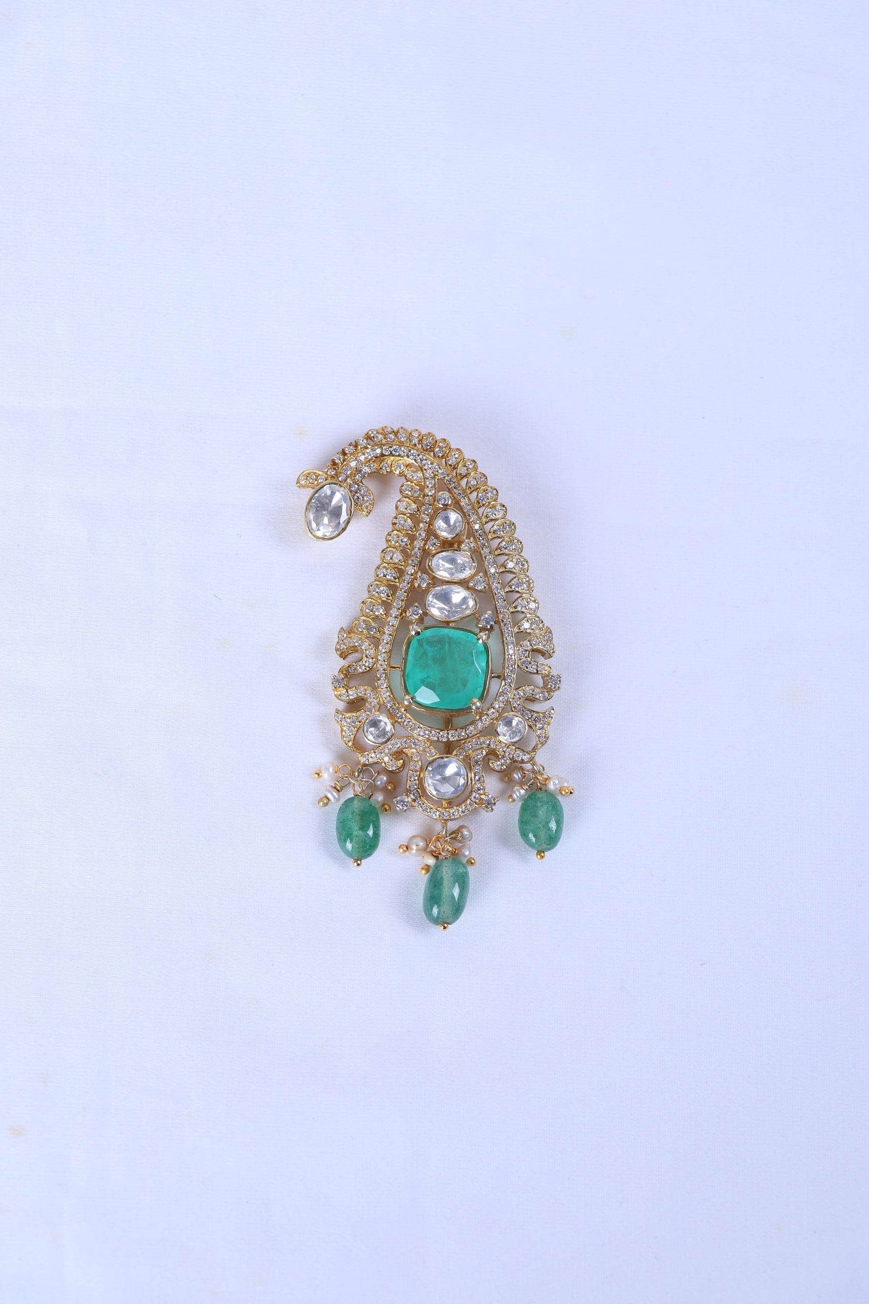 Silver brooch for men with paisley design, green stones and pearl accents for ethnic wear.