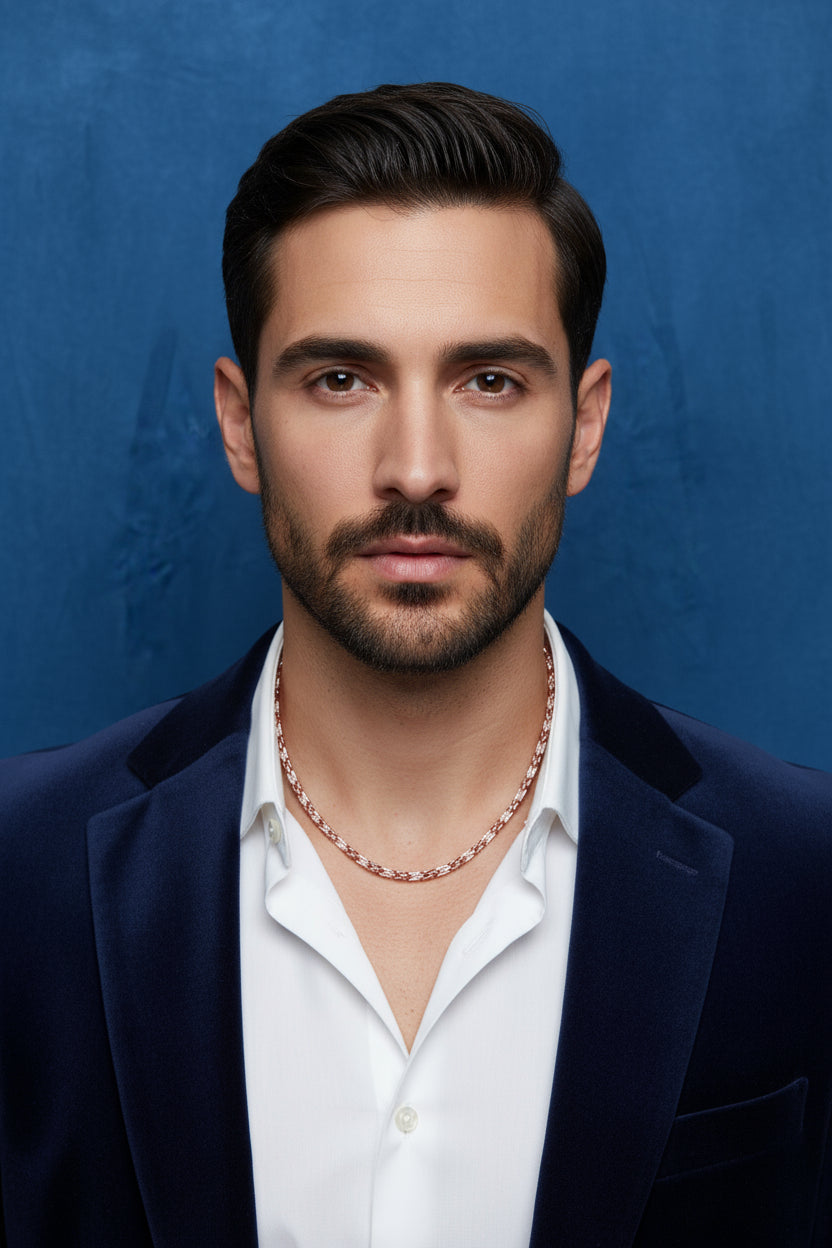 Silver necklace chain with multicolor link accents, worn on a men’s neck
