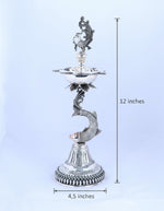 Silver-tone standing samai holder, bird crest and makara-like serpent with tiered base