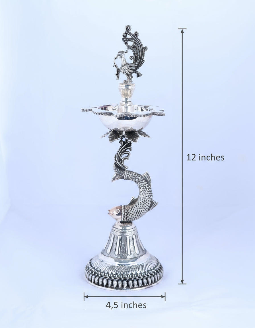 Silver-tone standing samai holder, bird crest and makara-like serpent with tiered base